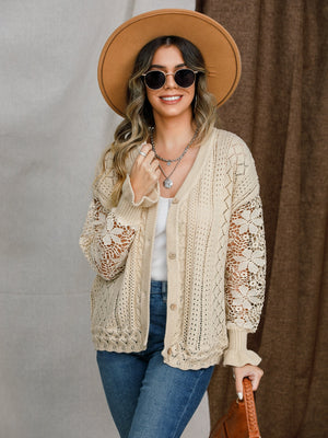 Tan lace sleeve knit cardigan with button front and cable knit details.
