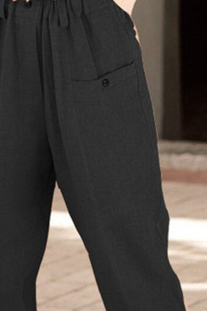 Black linen-blend trousers with button pocket detail