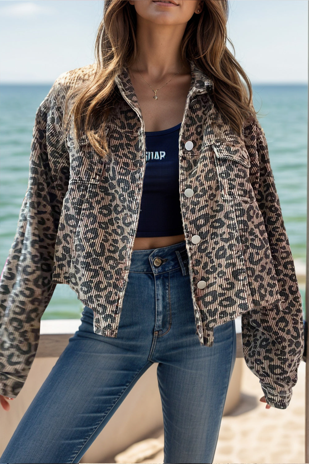Corded leopard print cropped jacket with button front and collar.