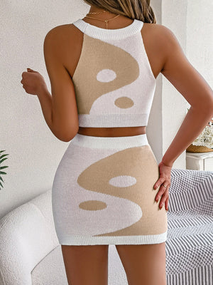 Yin Yang knit crop top and mini skirt set in white and tan acrylic.