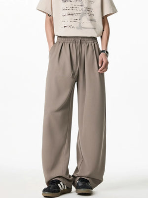 Relaxed taupe palazzo trousers with drawstring waist and wide leg