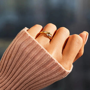 Gold two-tone intertwined open ring with a casual, modern design.