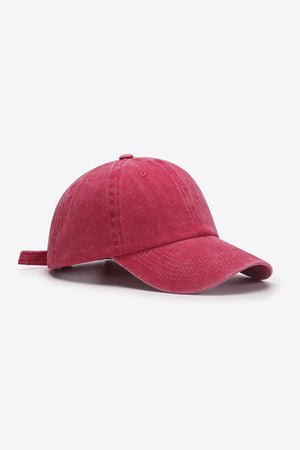 Washed cotton baseball cap in magenta with adjustable strap