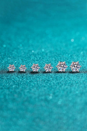 Six-prong moissanite stud earrings in silver, showing multiple sizes with brilliant cut stones.