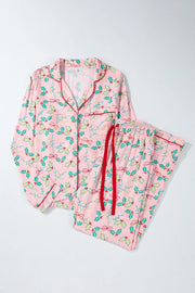 Blush pink pajama set with holly print, red piping, and red drawstring.