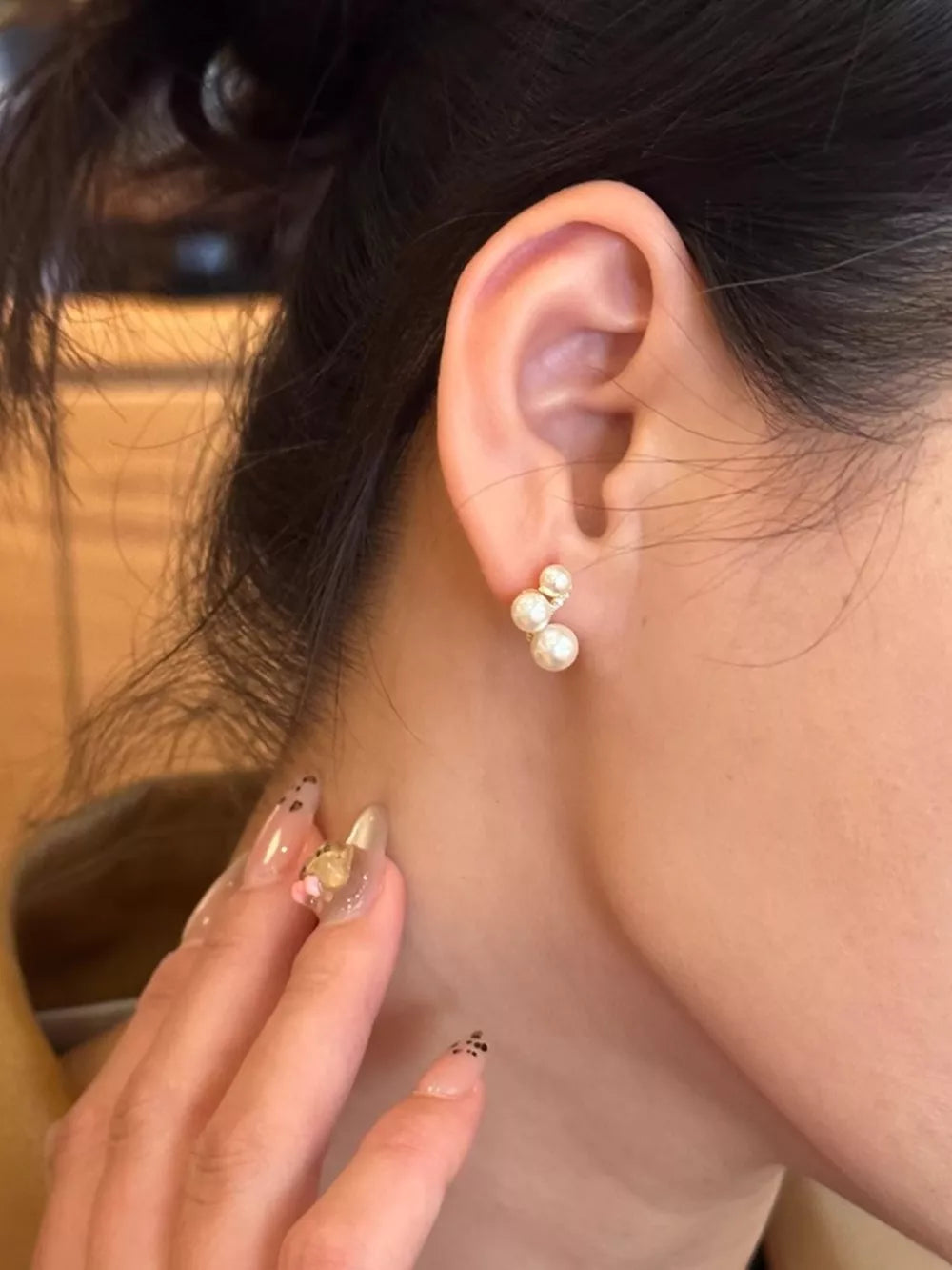 Gold cluster earrings with three pearls, delicate and elegant for women.