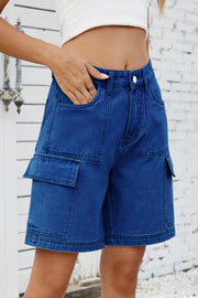 Medium wash denim utility shorts with large cargo pockets and contrast stitching.