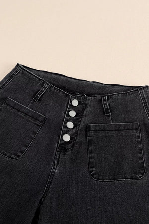 Black denim wide-leg jeans with button-fly and patch pockets.
