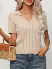 Tan cable knit short sleeve polo sweater with a v-neck.