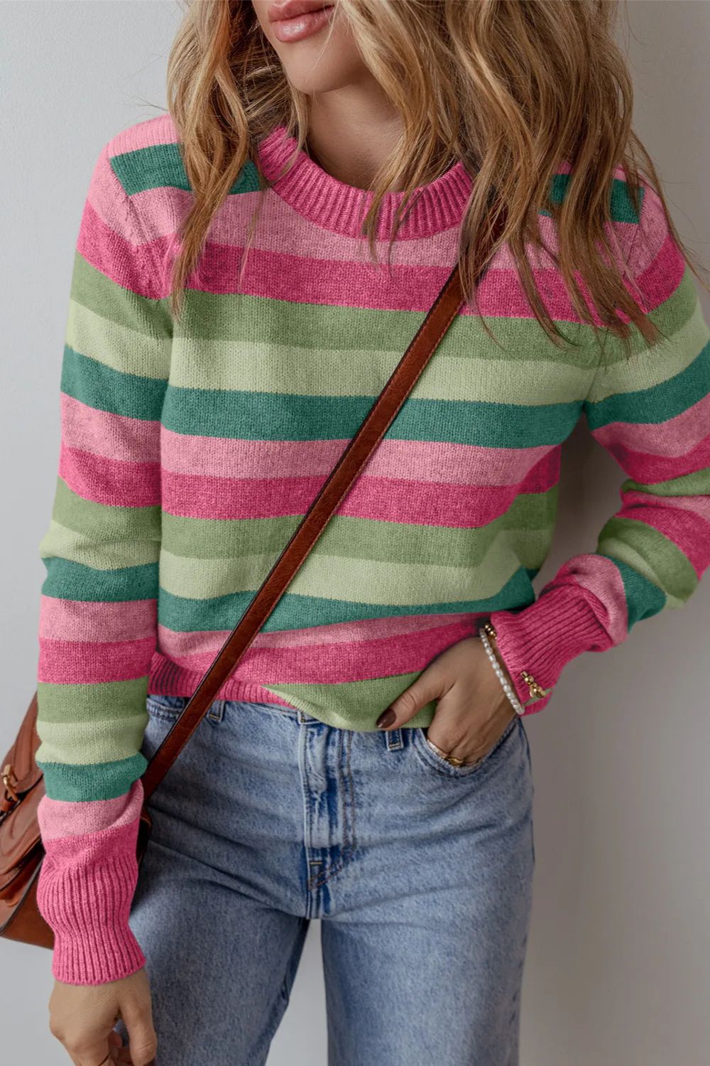 Striped crewneck knit sweater with pink and green stripes.