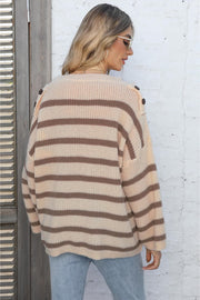 Apricot striped knit pullover sweater with button shoulder detail.