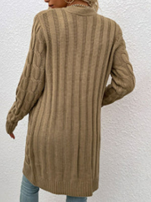 Tan cable knit button-down cardigan with ribbed texture and cable detail on sleeves.