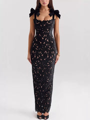 Black floral lace maxi dress with tie shoulder bows and cutout detail.