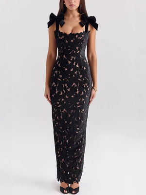 Black floral lace maxi dress with tie shoulder bows and cutout detail.