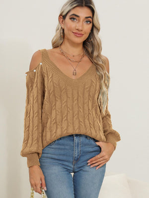 Camel cable knit cold shoulder sweater with button detail and V-neck.