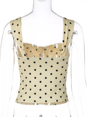 Pastel yellow polka dot tank top with sweetheart neckline and lace trim.