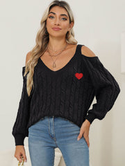 Black open shoulder cable knit sweater with red heart detail and v-neck