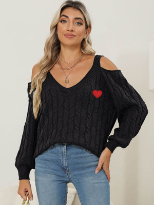 Black open shoulder cable knit sweater with red heart detail and v-neck