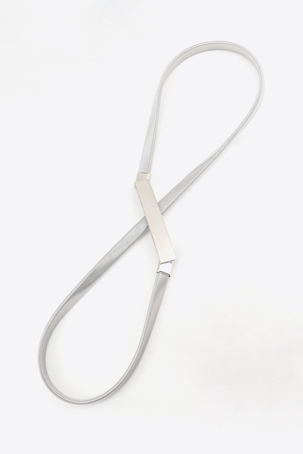 Silver slimline metal waist belt with a rectangular buckle detail