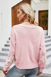 Pink knit cardigan with daisy embroidery on sleeves