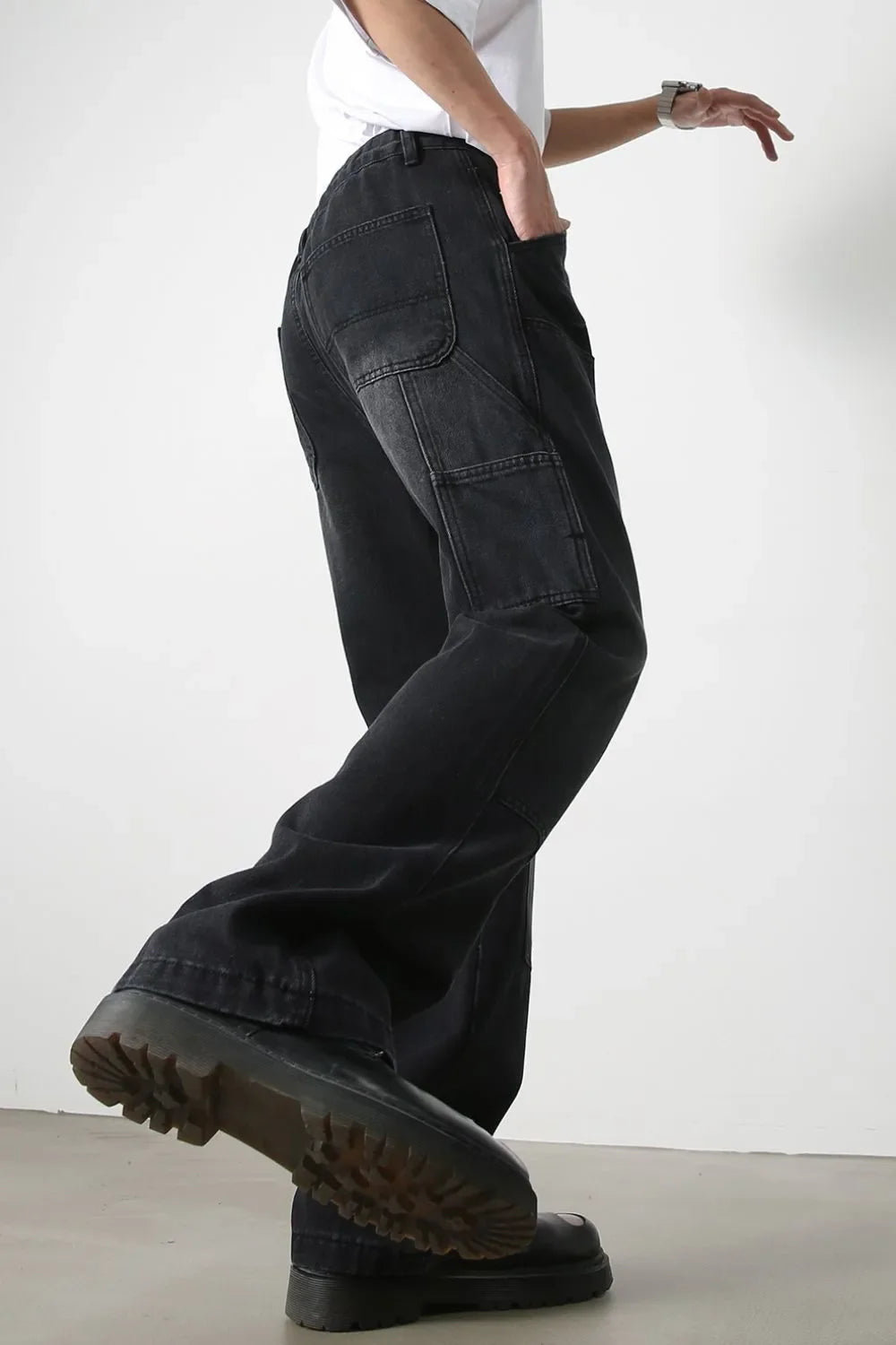 Dark denim wide leg carpenter jeans with utility pockets and a relaxed fit.