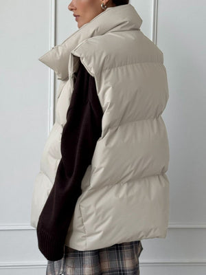 Padded collarless puffer vest in Dust Storm, with a high neckline and quilted detail.