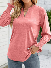 Burnt coral jersey v-neck top with gathered cuff long sleeves.