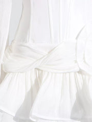 White ruffle mini dress with twisted waist detail and balloon sleeves