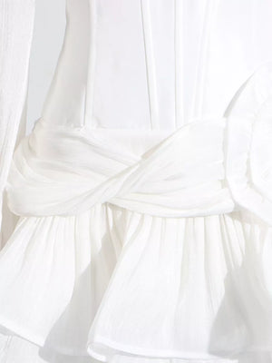White ruffle mini dress with twisted waist detail and balloon sleeves