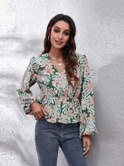Green tropical print peplum blouse with balloon sleeves and V-neck.