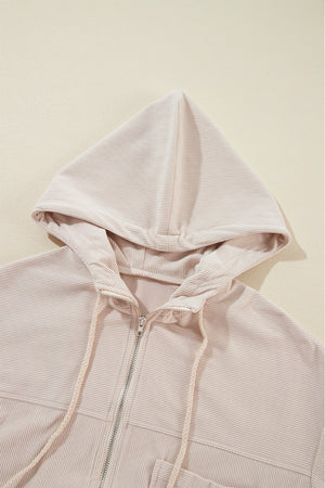 Cream corduroy bomber hoodie with zipper and drawstring hood detail