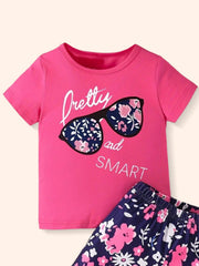 Pink graphic tee with sunglasses and floral shorts set for baby girls.