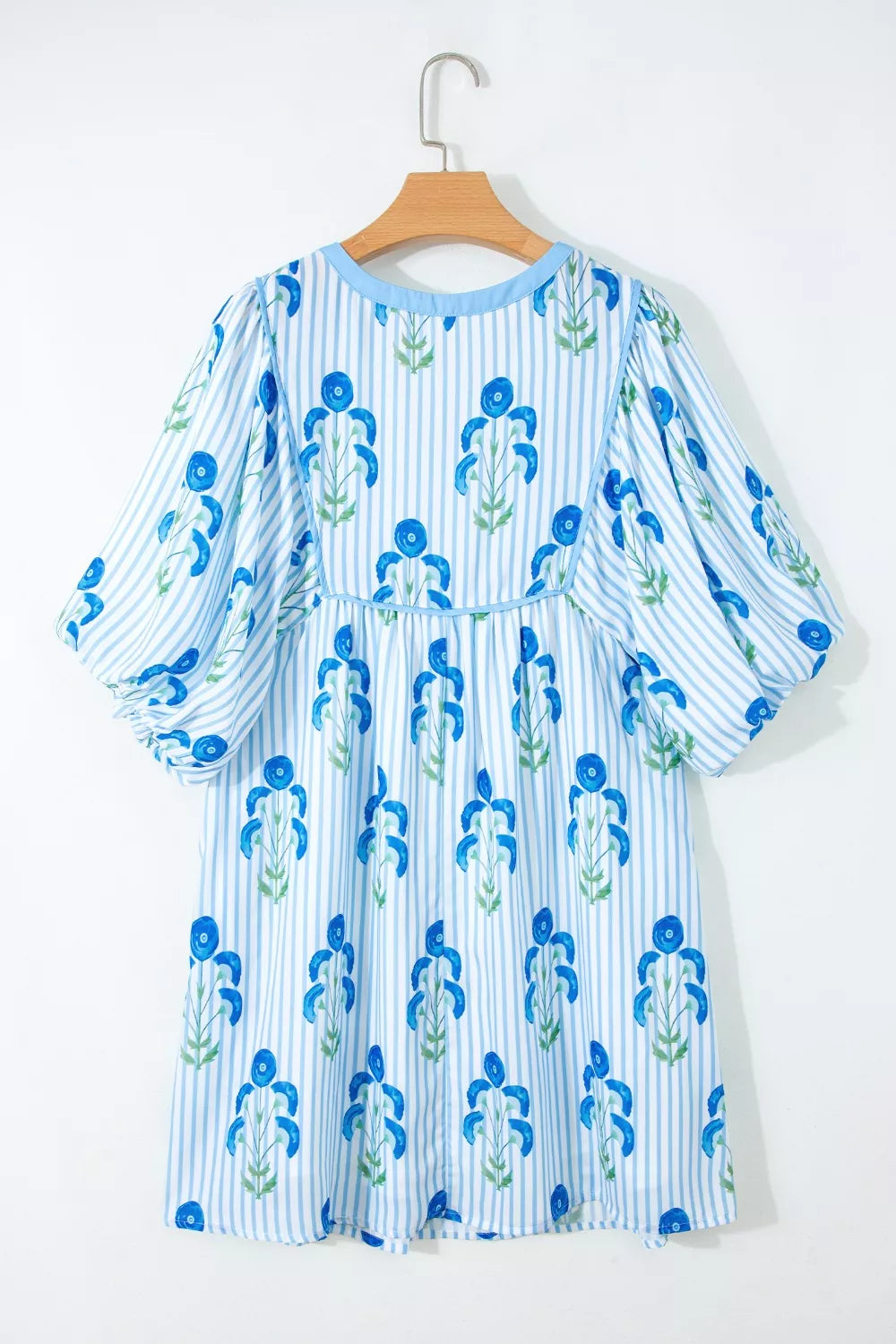 Floral stripe mini dress with puff sleeves and blue floral print.