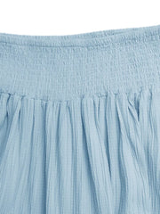 Blue smocked tiered maxi skirt with textured fabric and flowing elegance