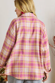 Oversized pink plaid button-down flannel shirt with a collared neckline and long sleeves.