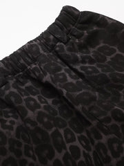 Men's grey leopard print sweatpants with elastic waistband and drawstring detail.