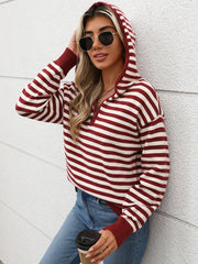 Burgundy striped knit hoodie with zip neck and cuffed sleeves.