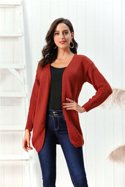 Draped knit open-front cardigan in deep red, 100% acrylic, with long sleeves and a relaxed fit.