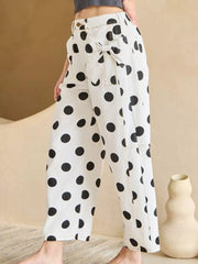 White polka dot denim jeans with high waist and bow details
