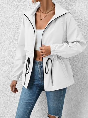 White utility jacket with cinched waist and drawstring details, black trim, and hood.