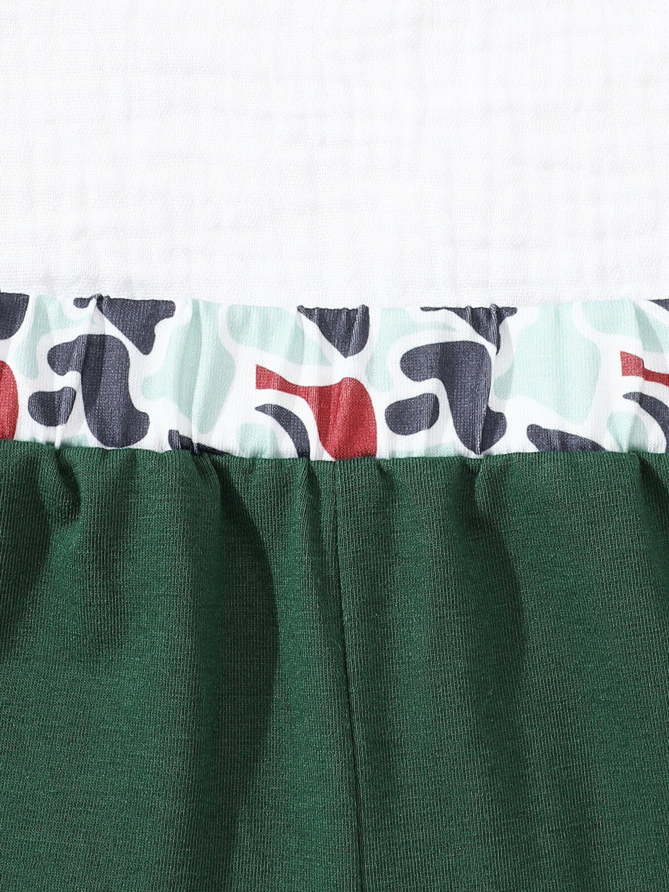 Baby polo and shorts set in dark green with camouflage trim.
