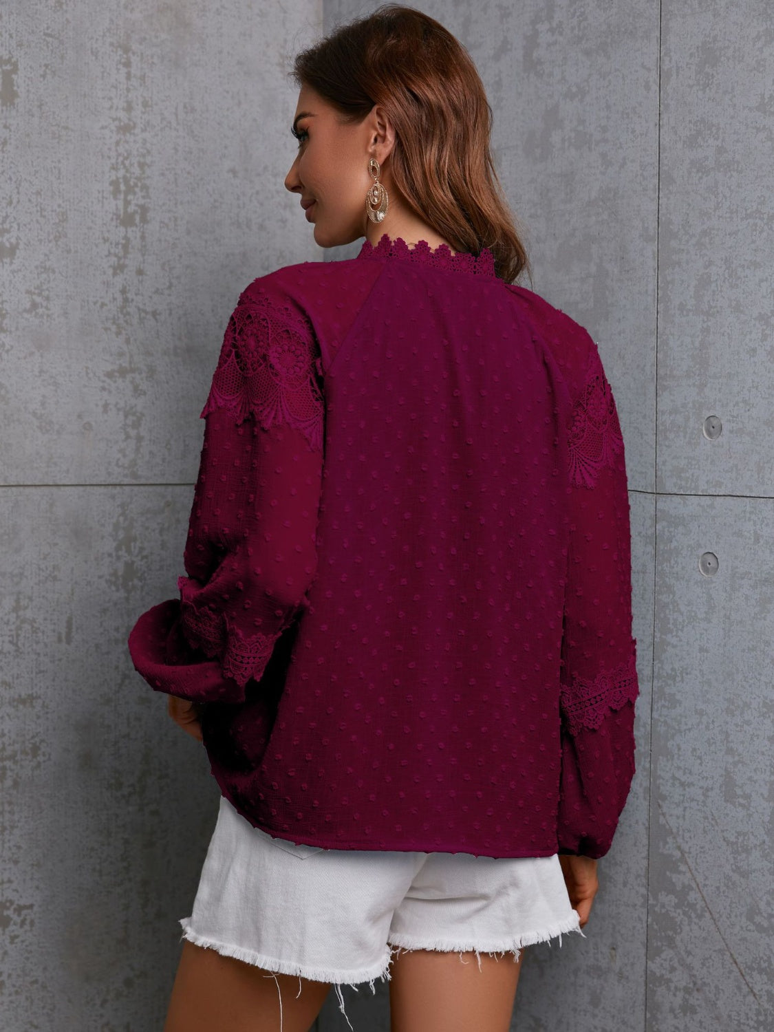 Textured wine blouse with lace trim on neckline and sleeves.