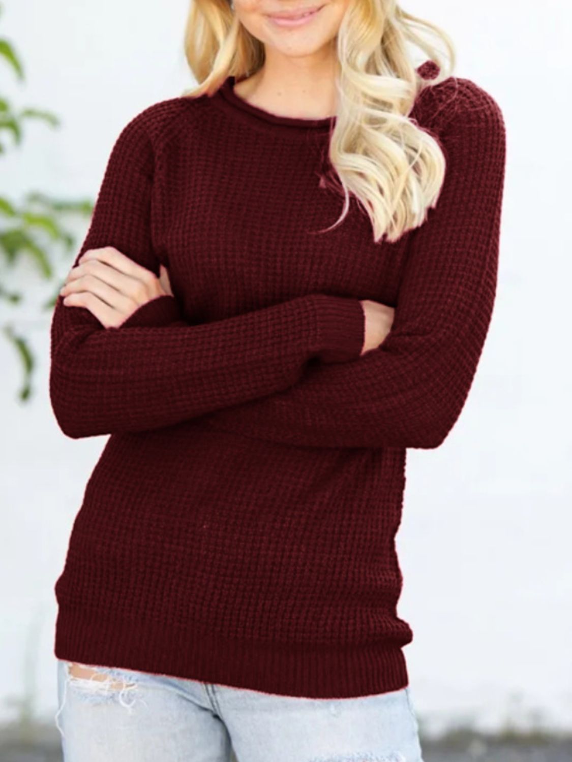 Burgundy textured raglan knit pullover sweater with honeycomb pattern.