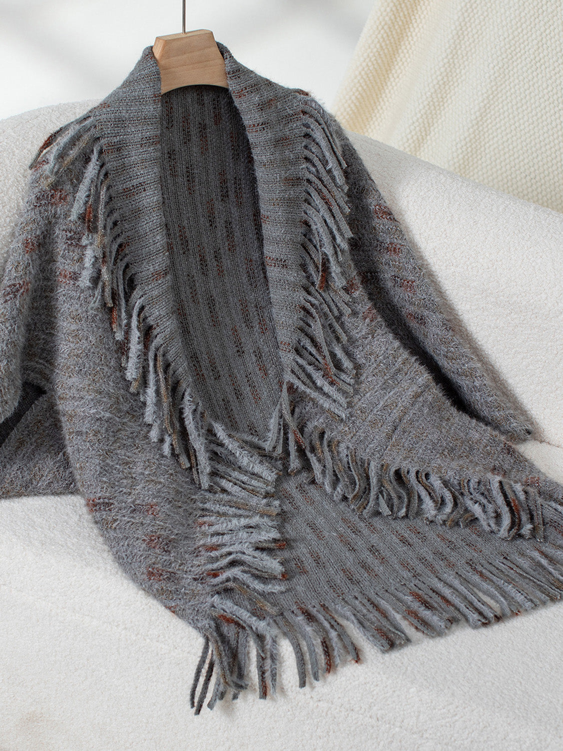 Textured fringe shawl cardigan in dark gray acrylic with a relaxed fit and open front.