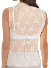 Sheer mock neck lace tank top in cream with floral pattern and visible bra straps.