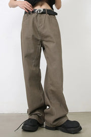 Taupe wide-leg denim trousers with a relaxed fit and a black belt.