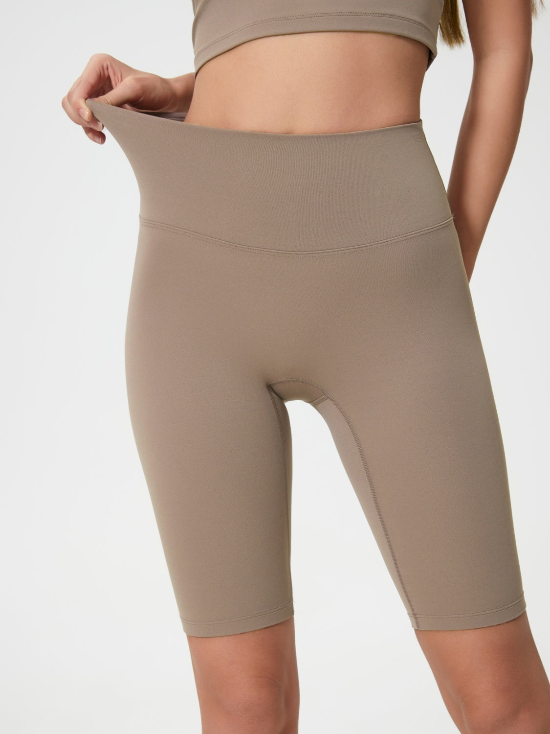 Sculpted Contour active cycling shorts in Mocha with a high waist and seamless design.