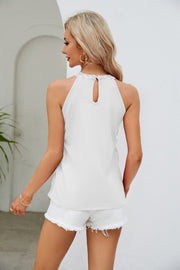 White sequin halterneck tank top with keyhole back detail and lace trim.