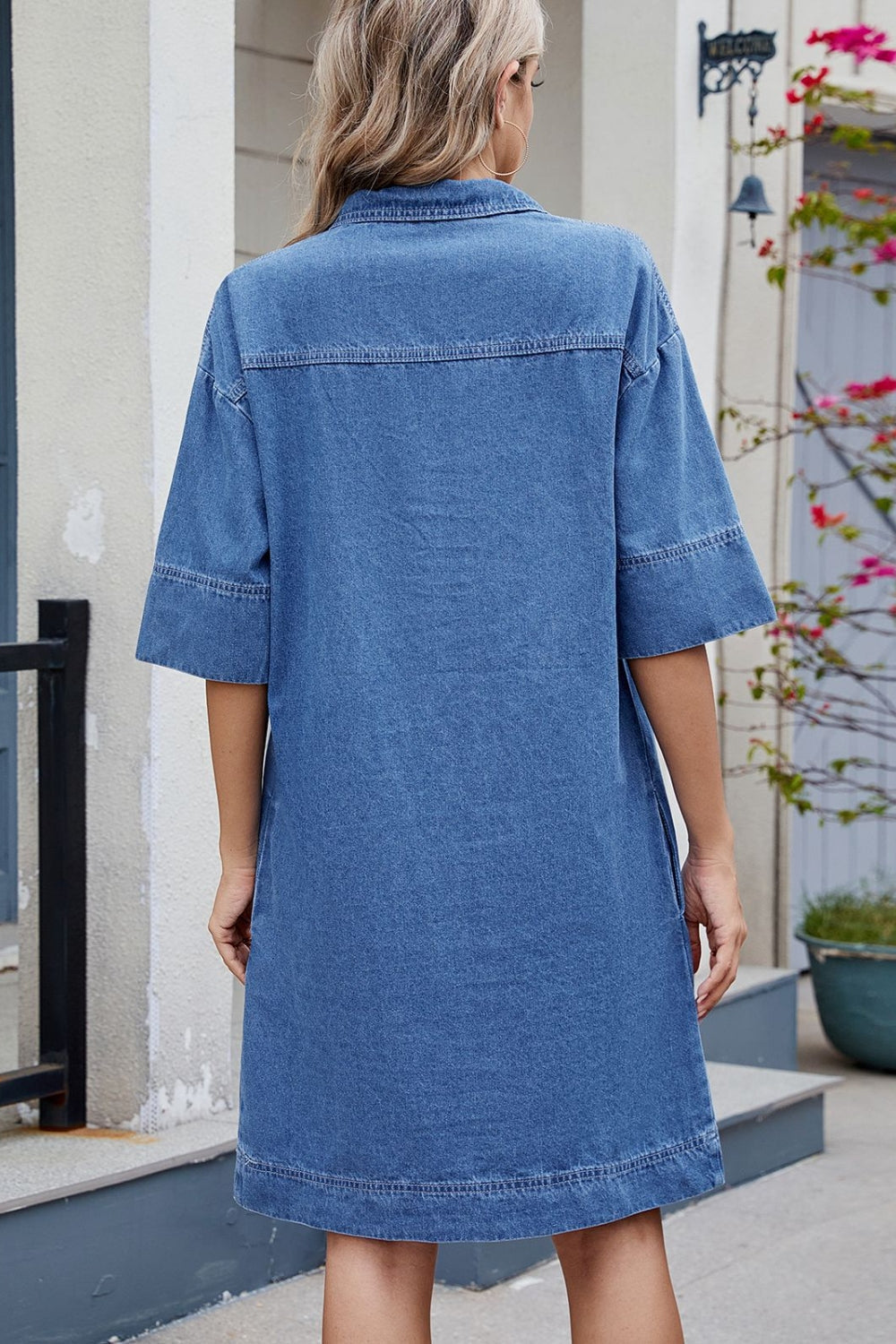 Collared denim mini dress in dark wash with short sleeves and pockets.