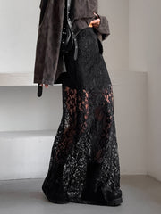Black lace maxi skirt with sheer detail and a flared hem.